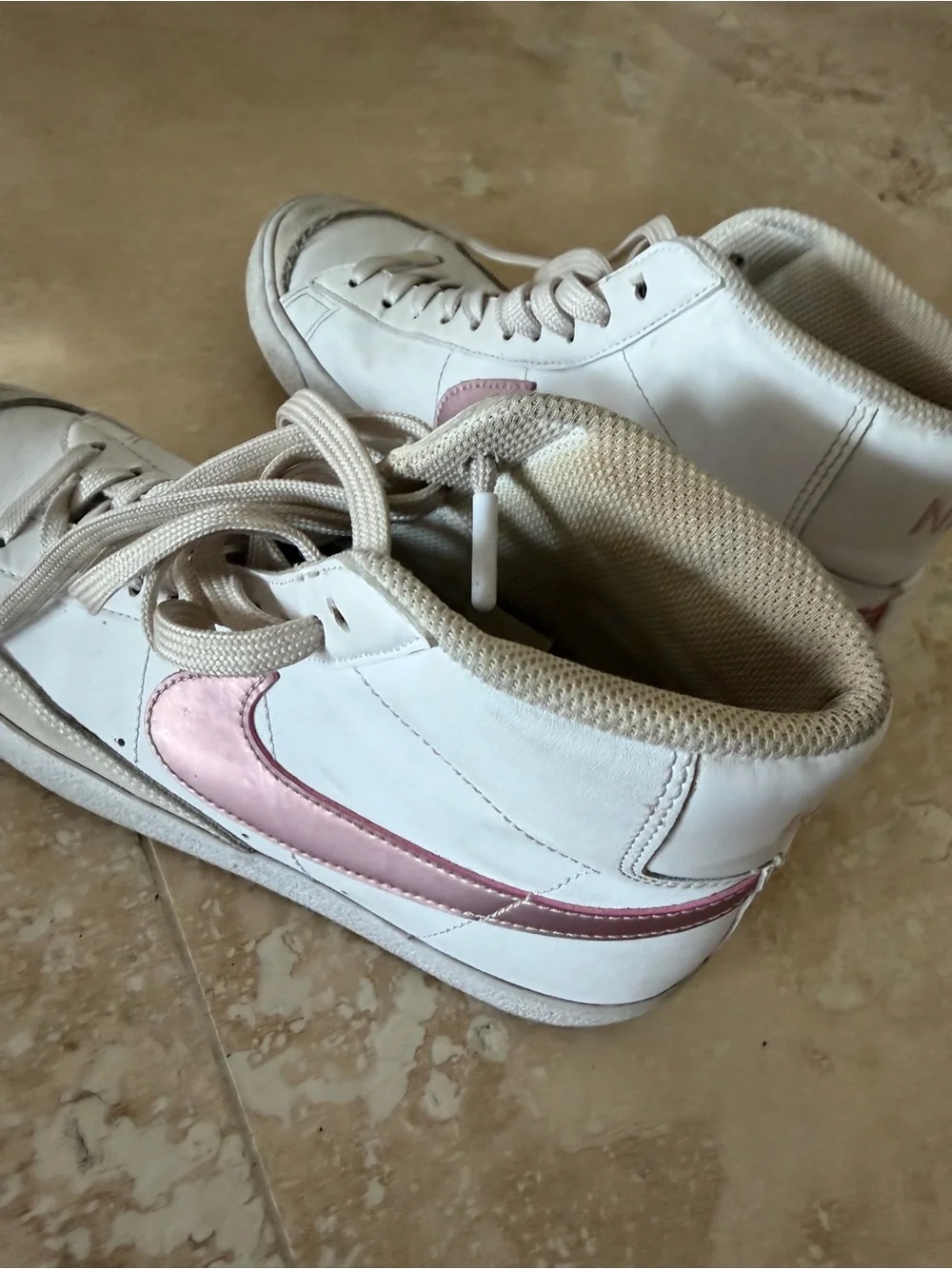 Nike Women’s White High-Top Sneakers with Pink Swoosh Accent